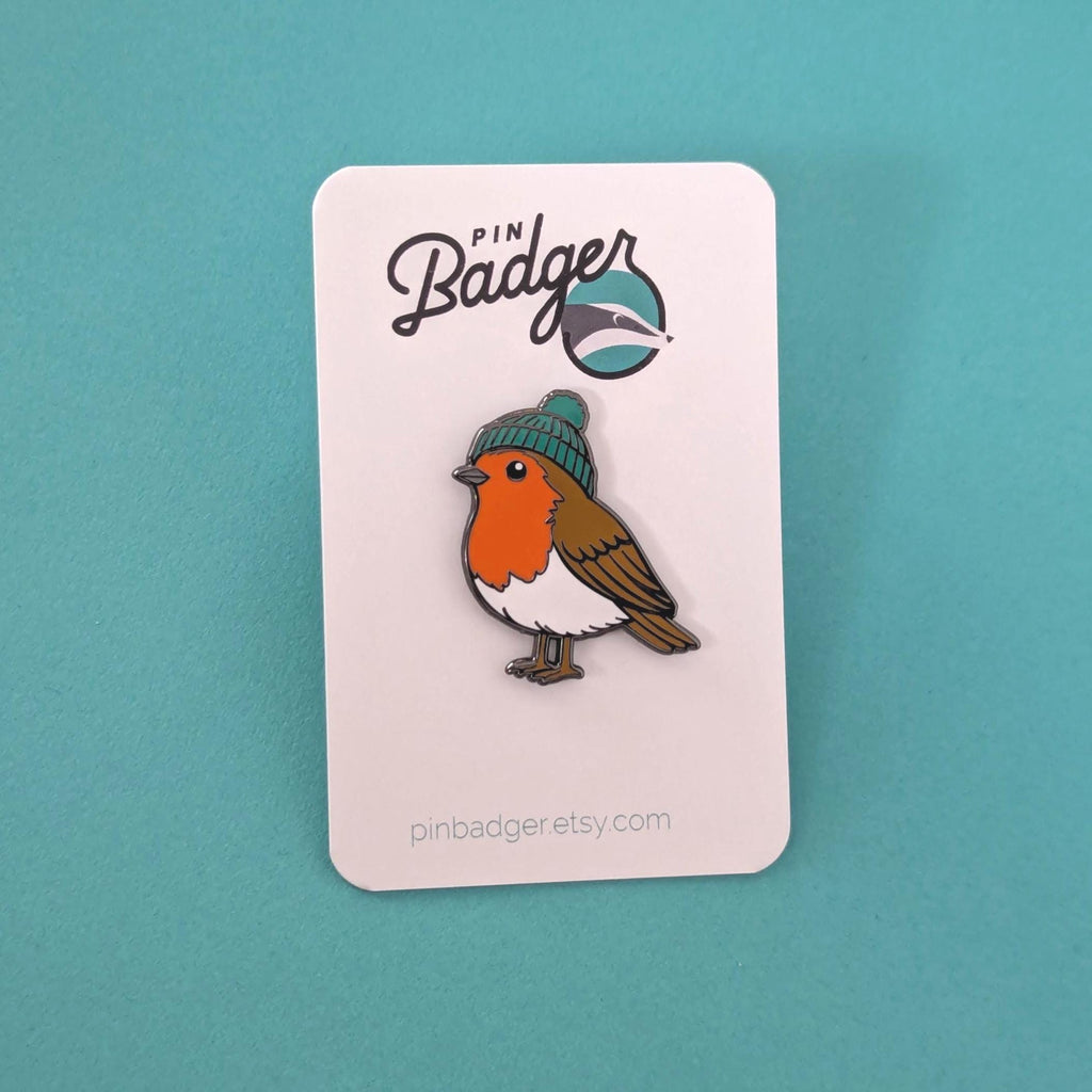 Robin pin on a card with 'pin Badger' branding against a teal background