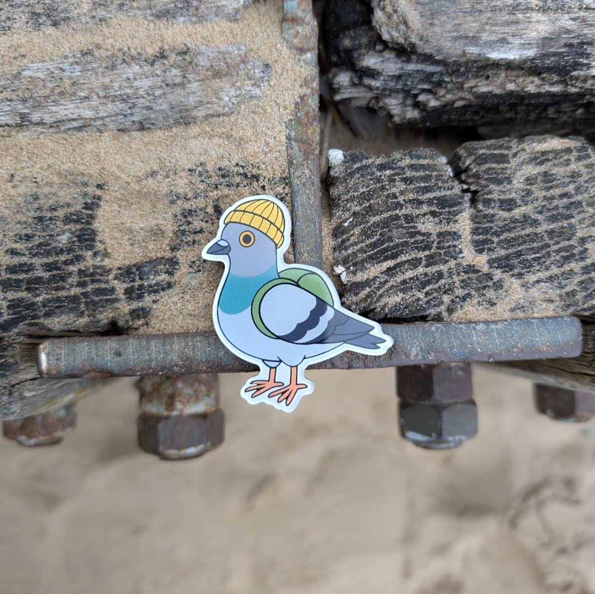 urban pigeon fridge magnet in an industrial setting next to a beach