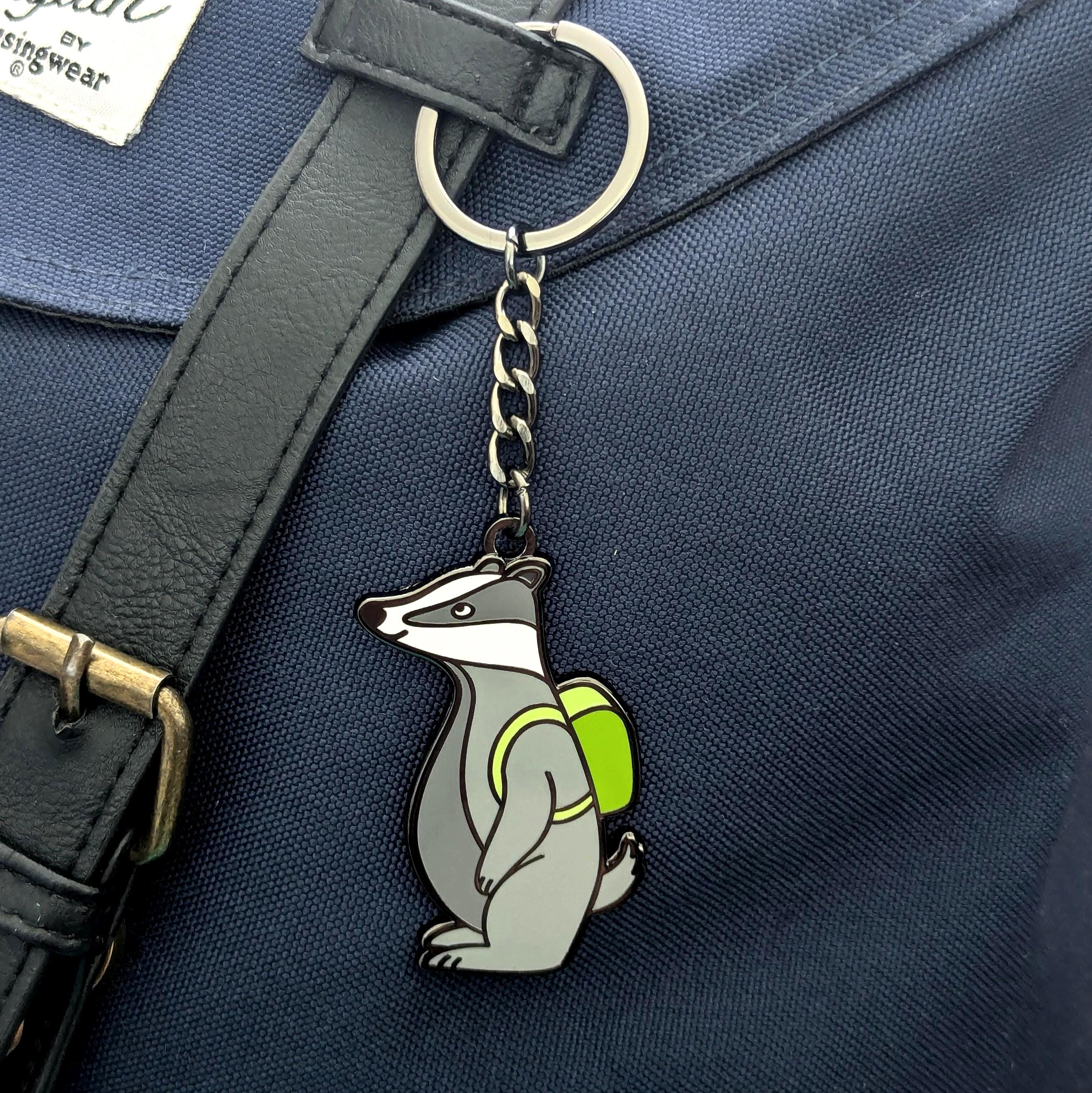 Keychain with a badger design on a blue bag