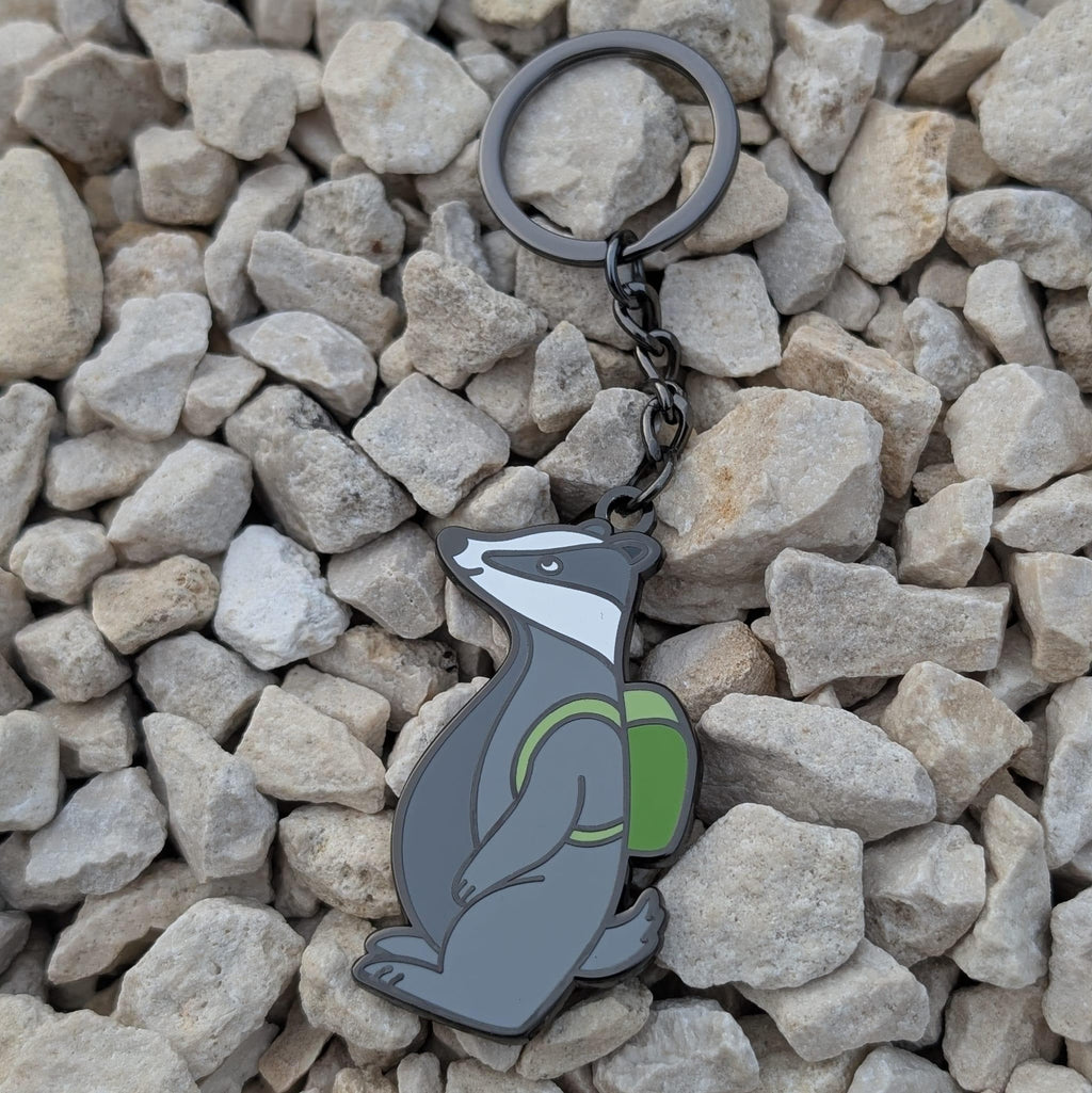 Keychain with a badger design on a bed of stones