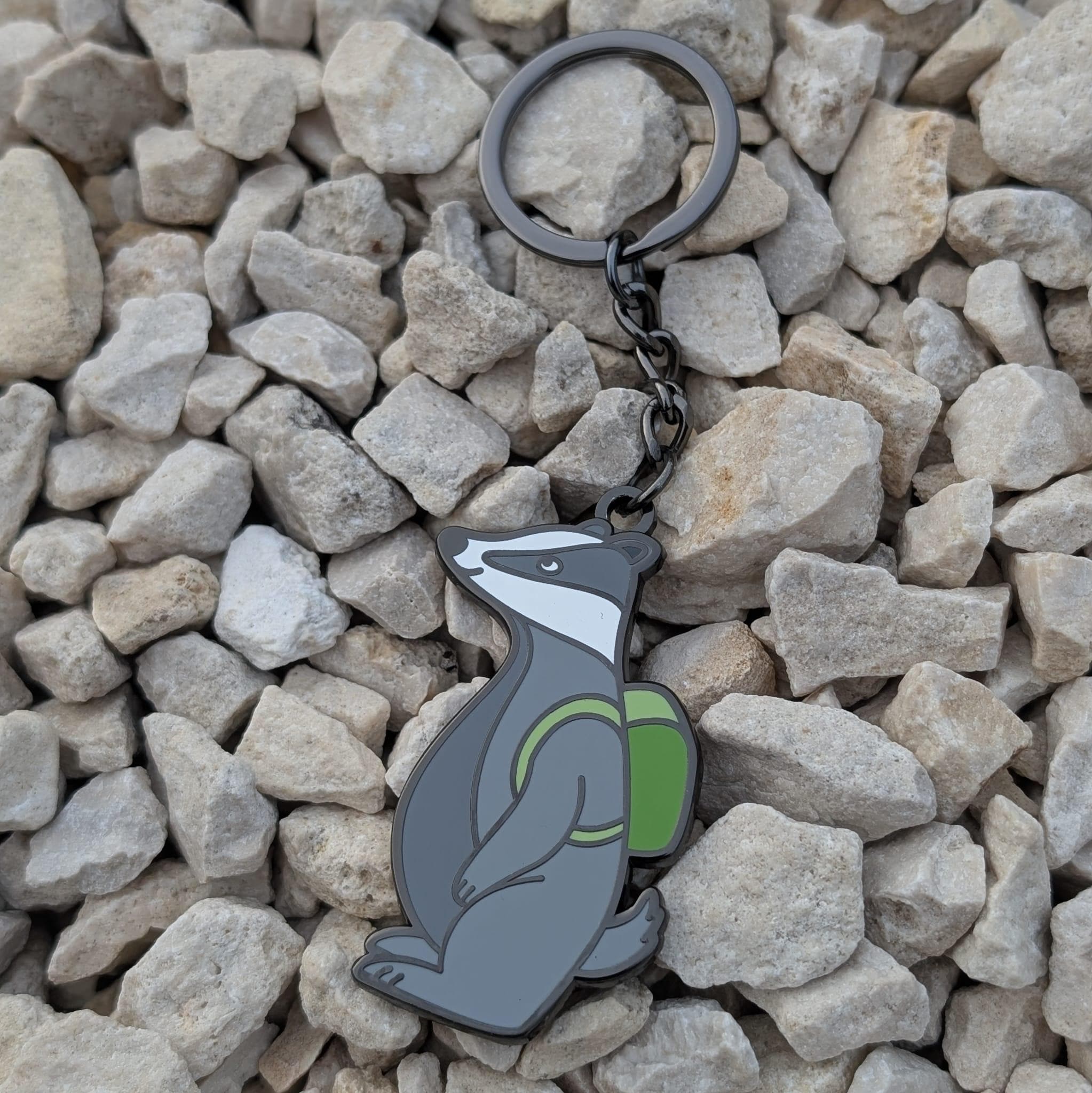 Keychain with a badger design on a bed of stones