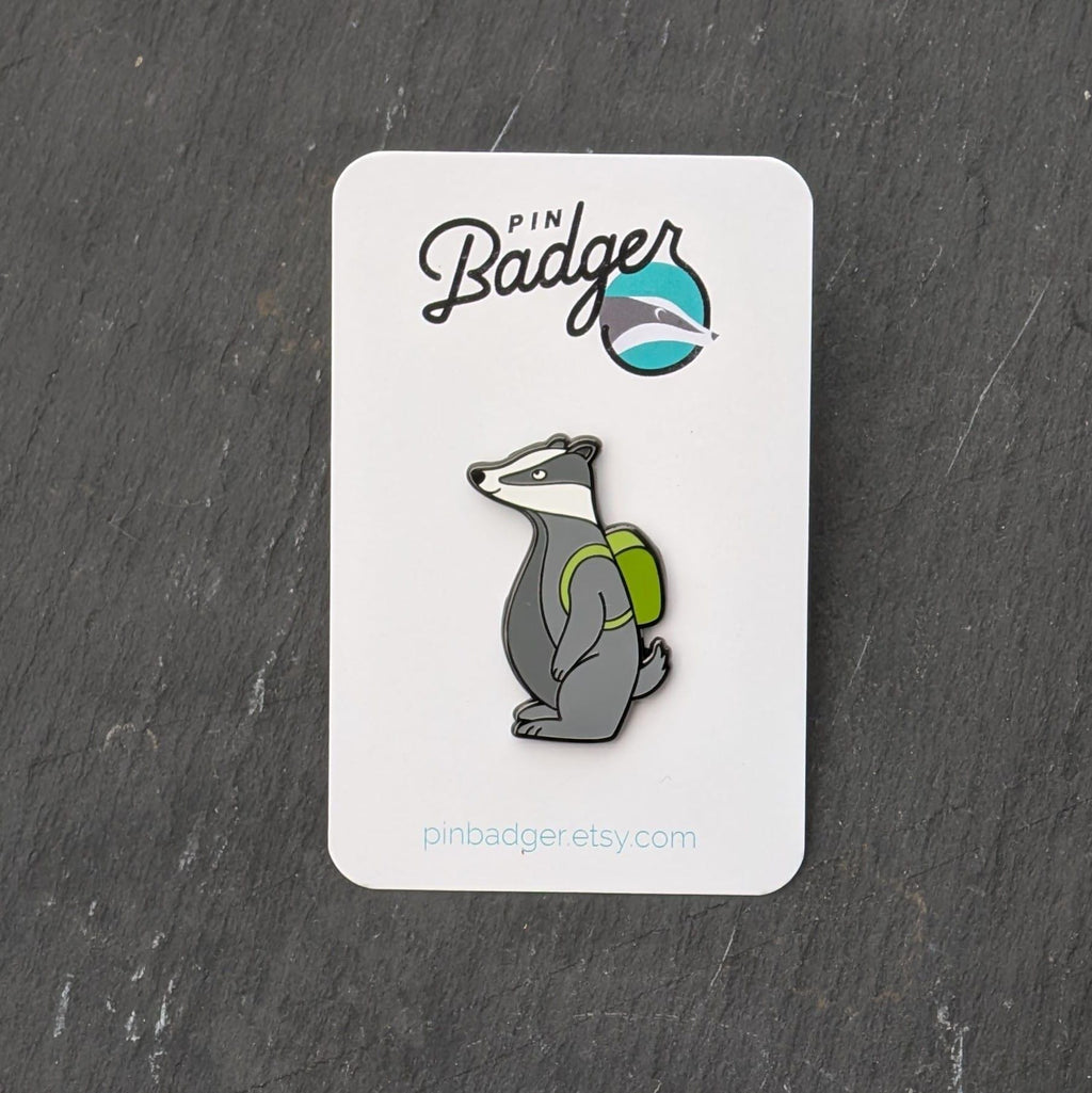 Badger pin on a card with 'Pin Badger' branding on a dark surface