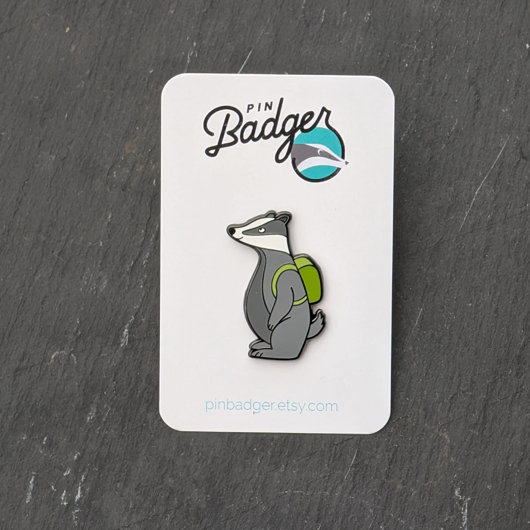 Badger pin on a card with 'Pin Badger' branding on a dark surface