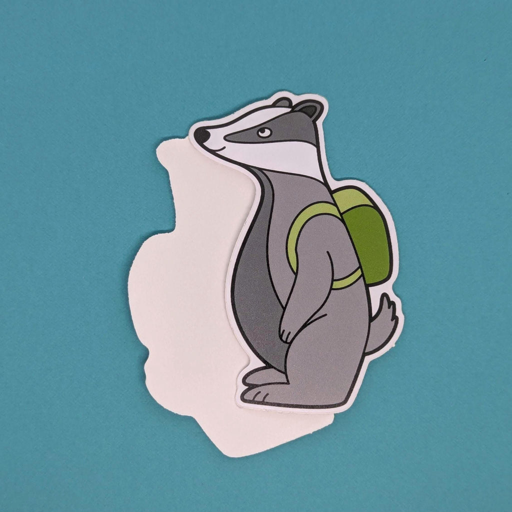 Sticker of a badger with a green backpack on a teal background
