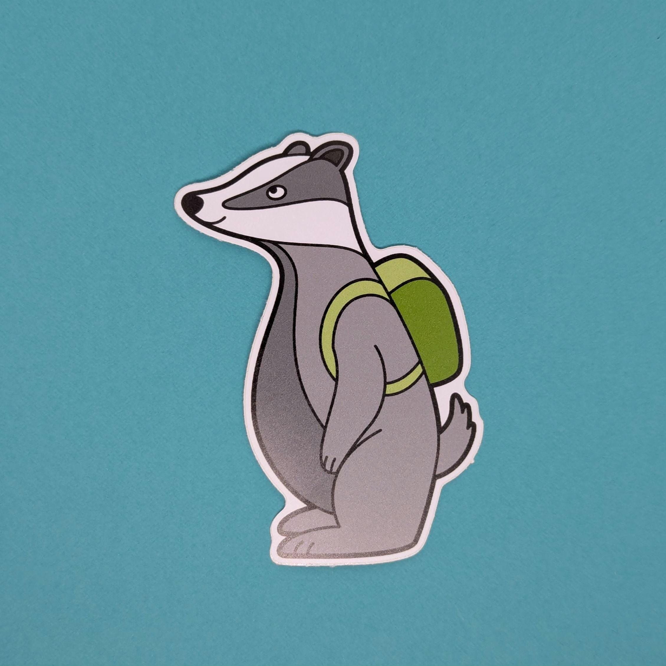 Sticker of a badger with a green backpack on a teal background