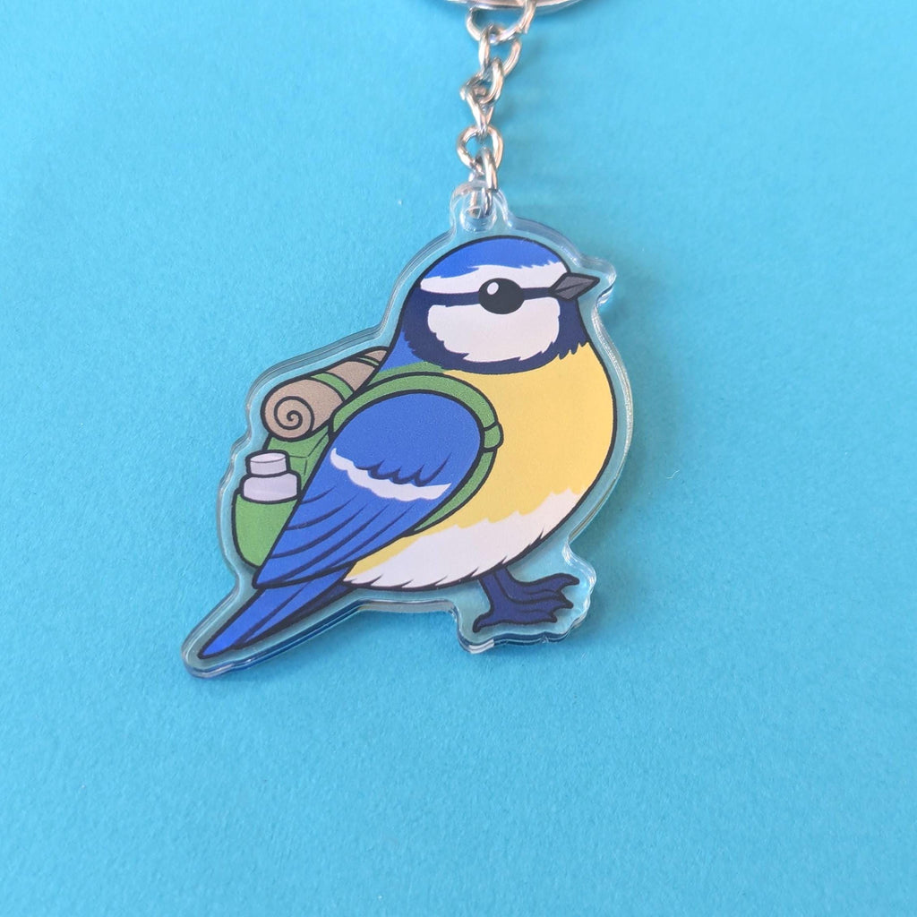 Keychain with a blue and yellow bird design on a blue background