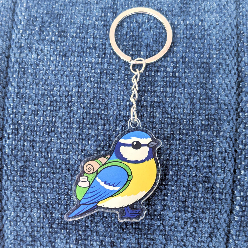 blue tit keychain on a blue denim background