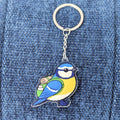 blue tit keychain on a blue denim background