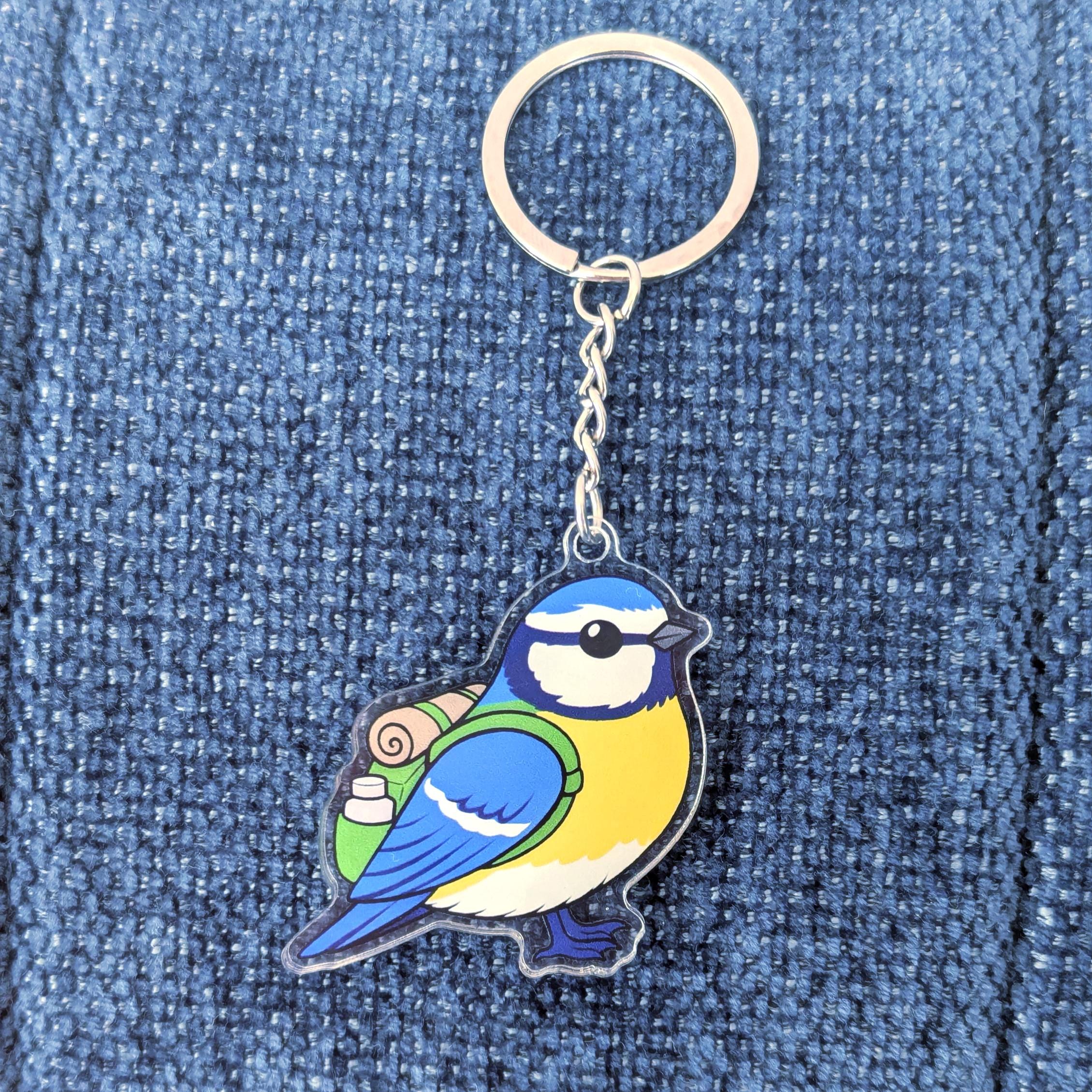 blue tit keychain on a blue denim background