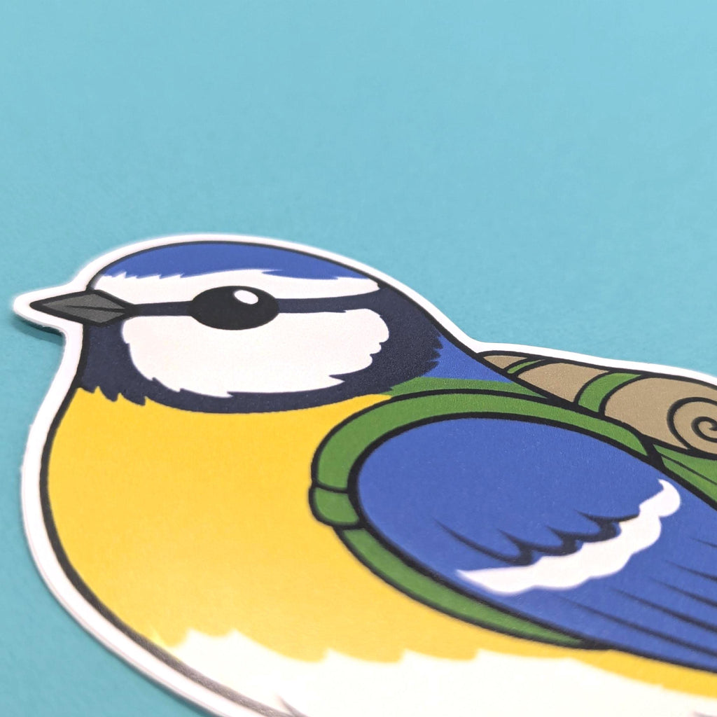 Close up of blue tit sticker on a teal background