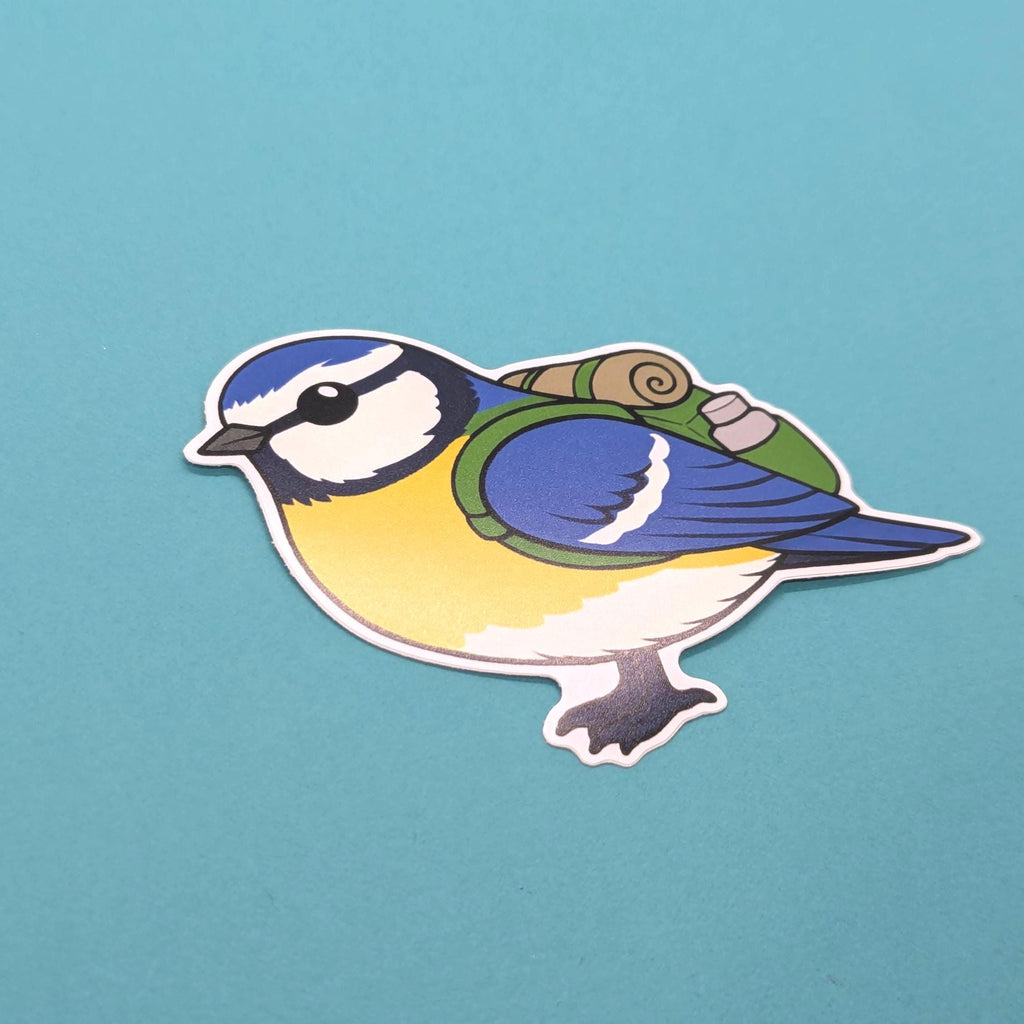 Sticker of cute blue tit with a hiking bag and flask