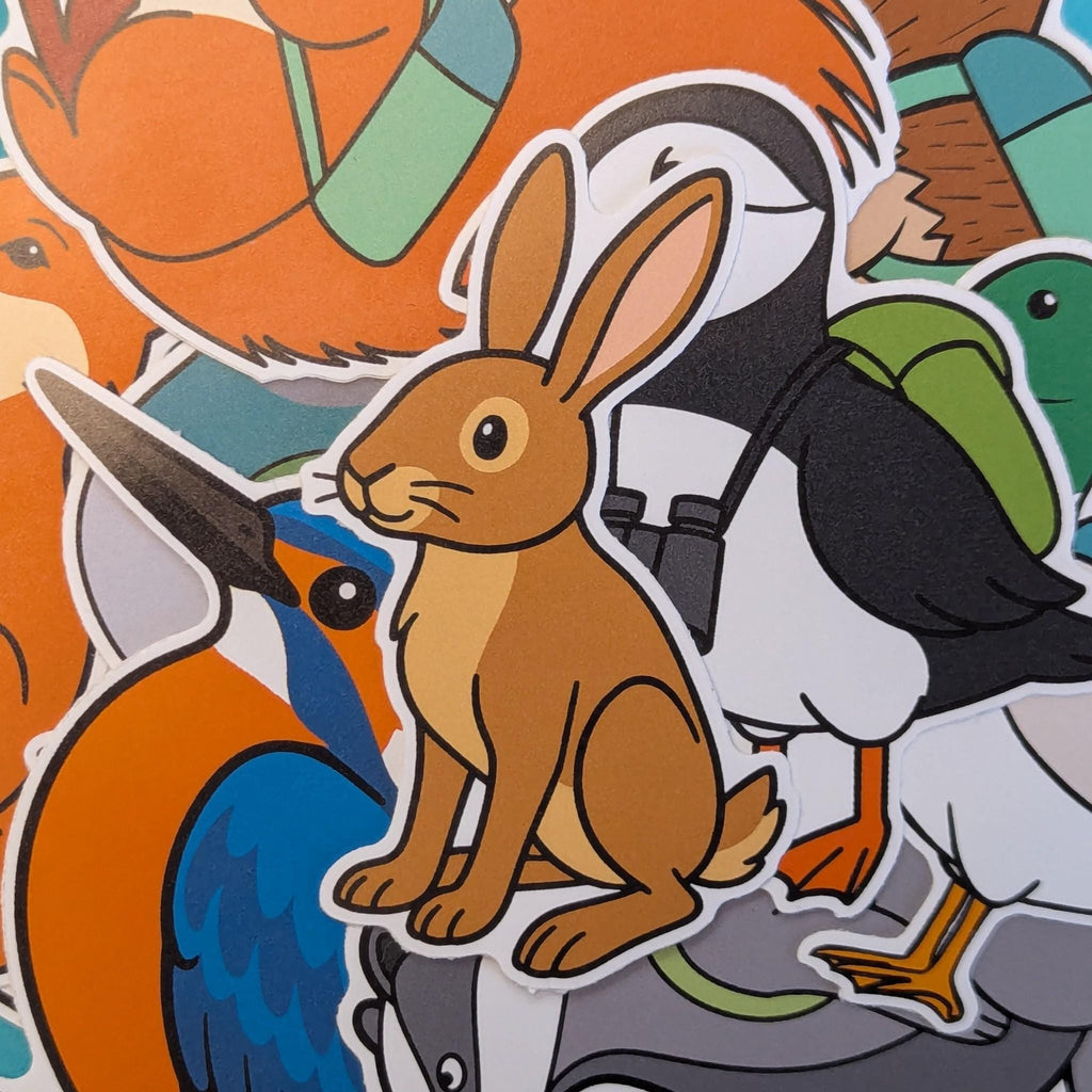 brown hare vinyl sticker with other pin badger vinyl stickers in the background