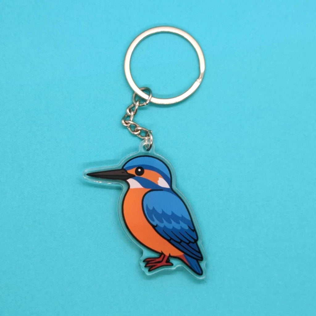 Keychain with a bird design on a blue background