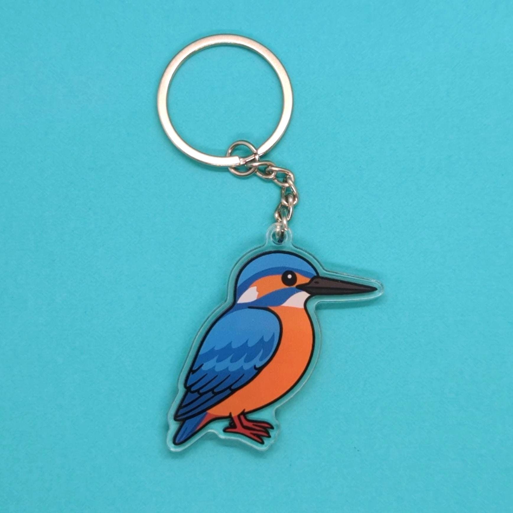 Keychain with a kingfisher design on a blue background