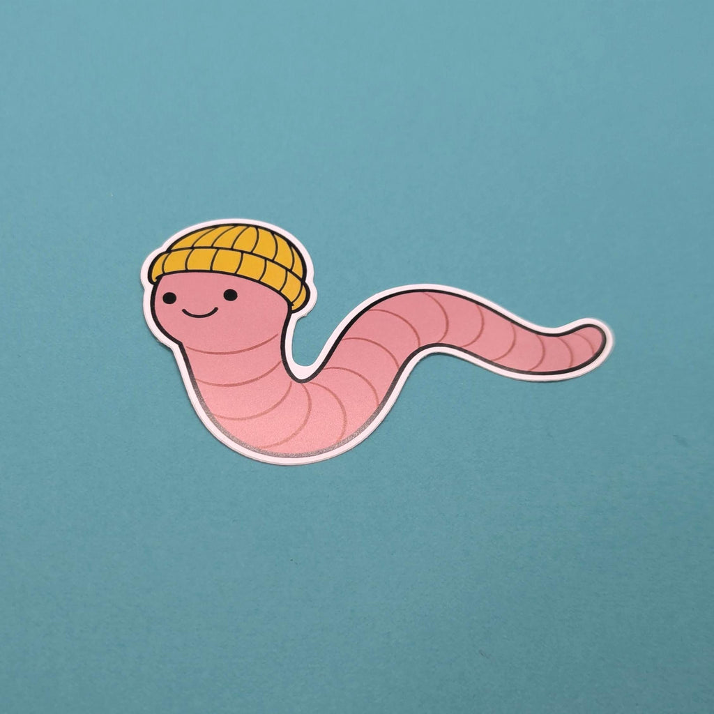 Cartoon worm wearing a yellow hat on a blue background