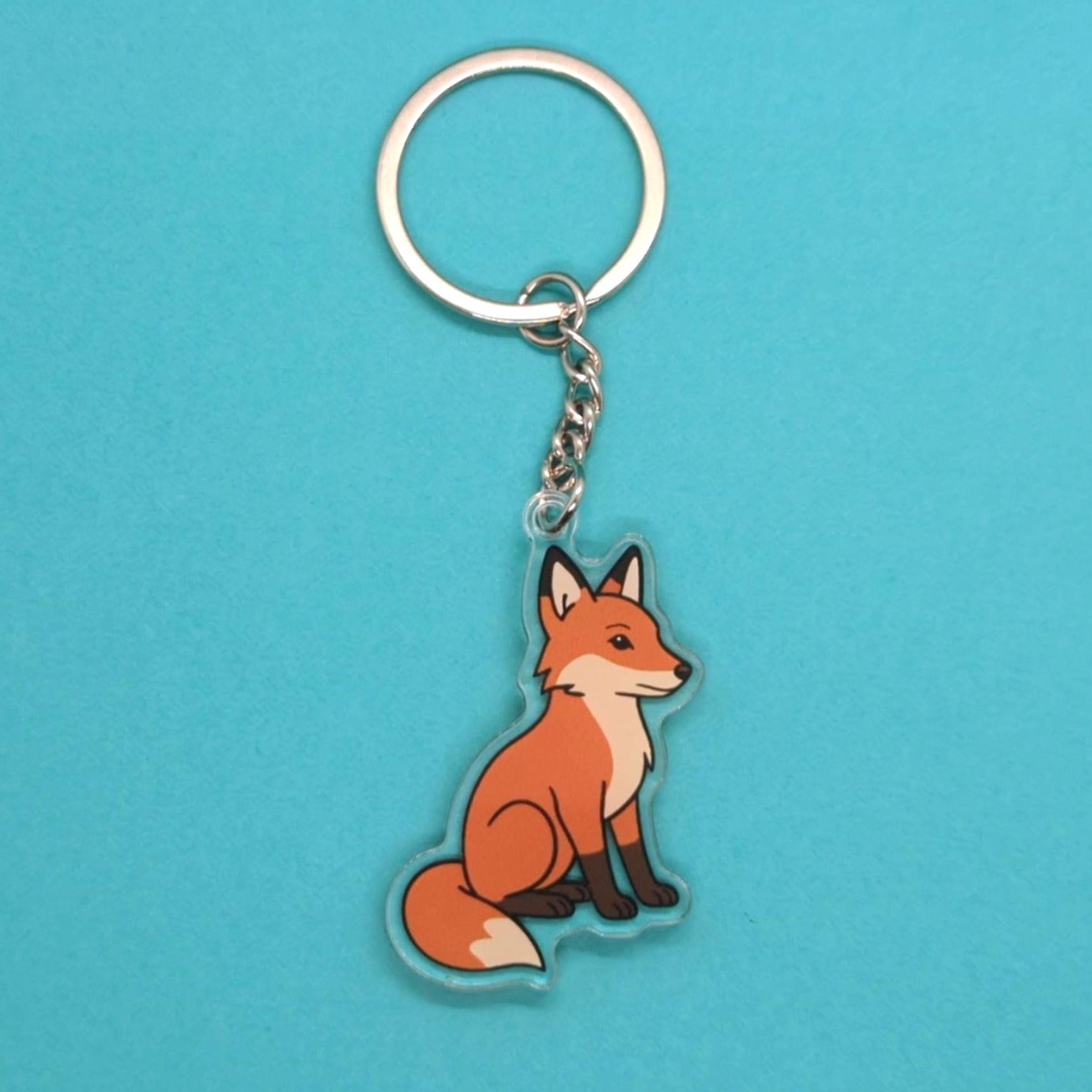 Fox keychain on a blue background