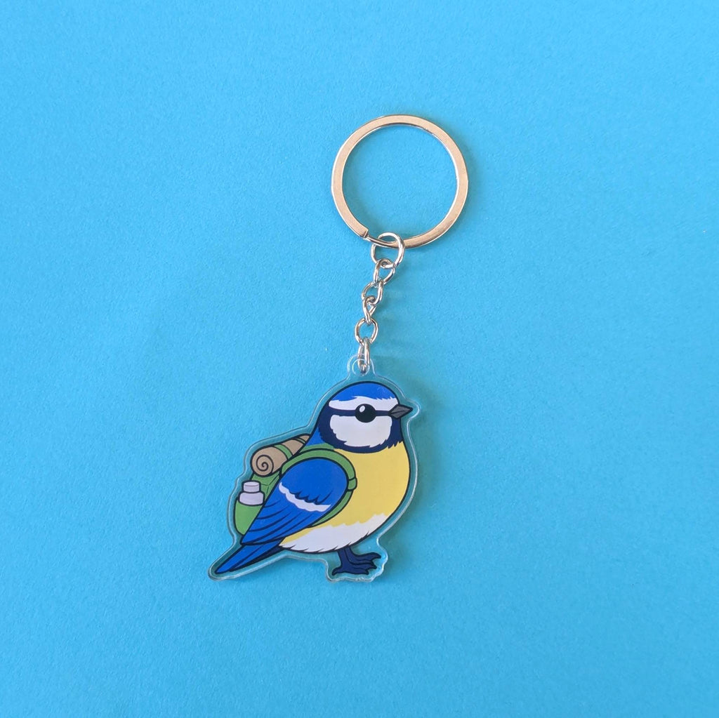 blue tit bird keychain on a blue background