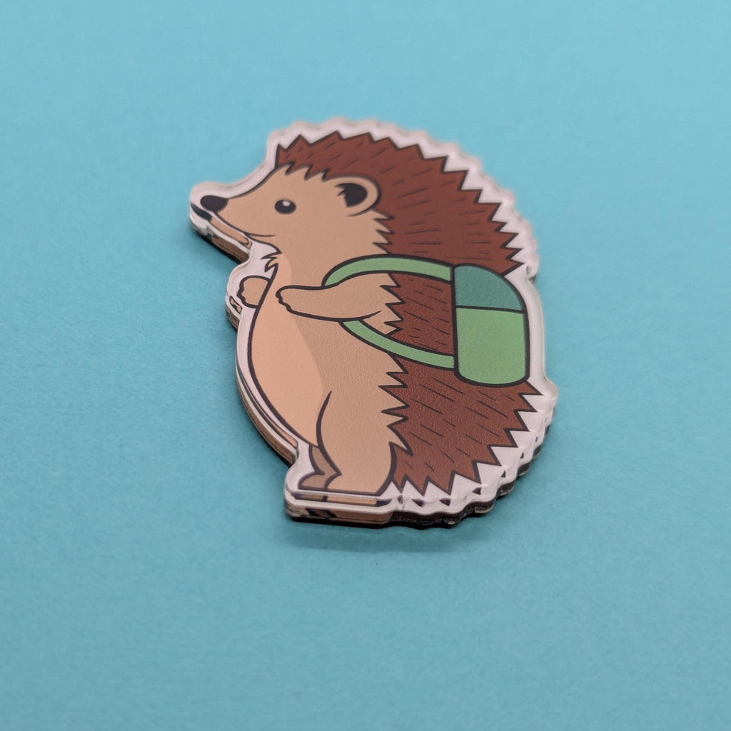 Hedgehog with a green backpack on a blue background