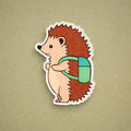 Cartoon hedgehog with a backpack on a beige background
