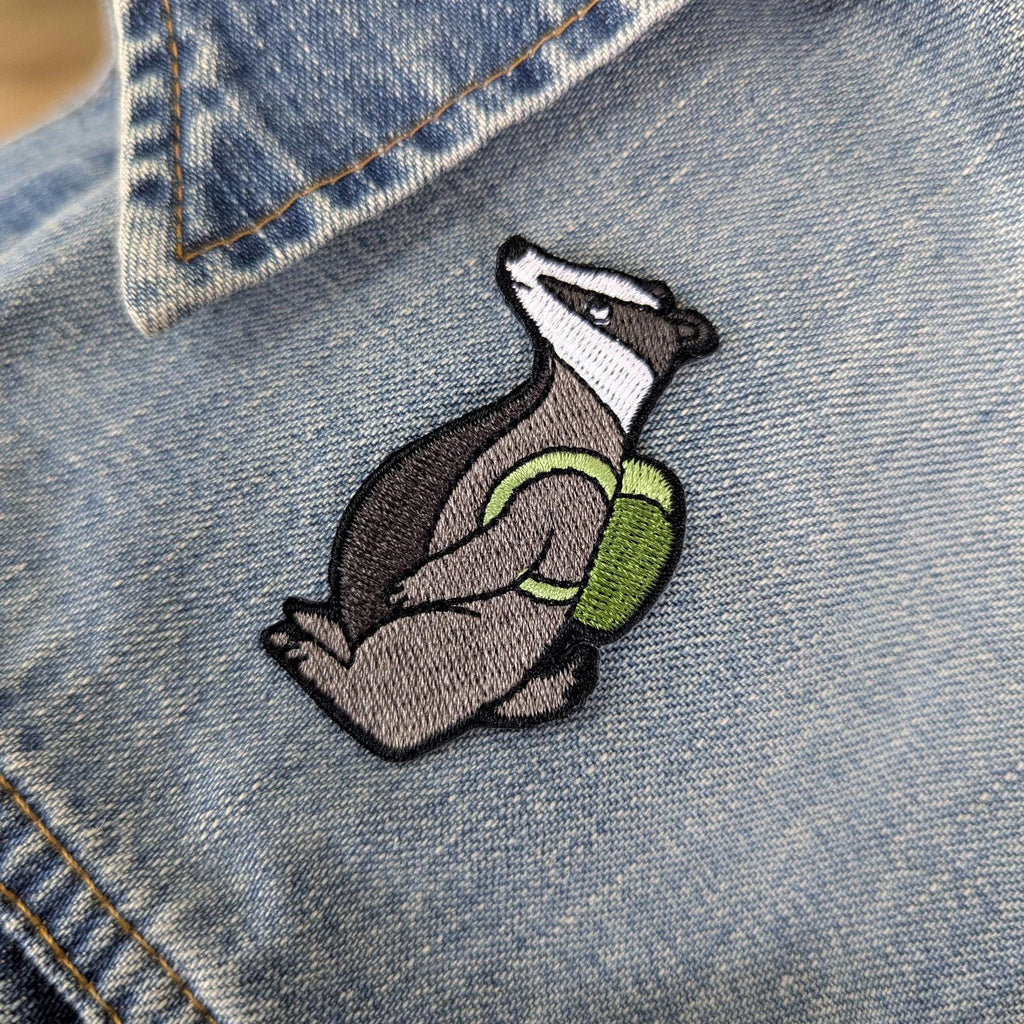 Embroidered badger patch on a denim jacket