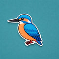 Colourful kingfisher fridge magnet on a teal background