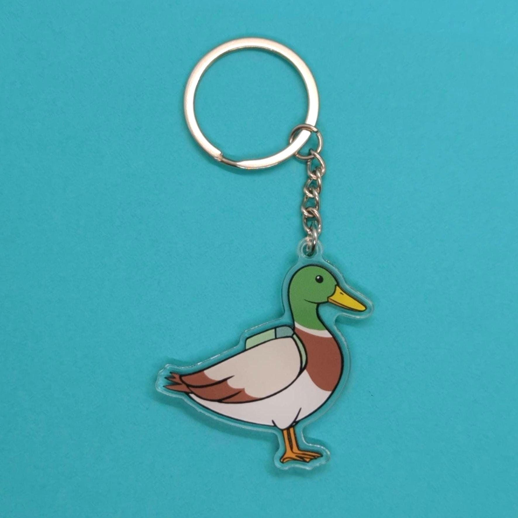 mallard duck keychain on a blue background
