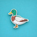 Duck fridge magnet on a blue background