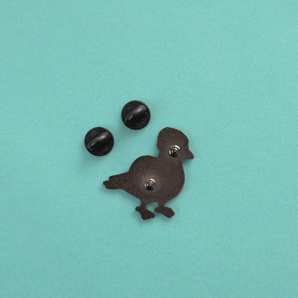 back view of pigeon pin badge