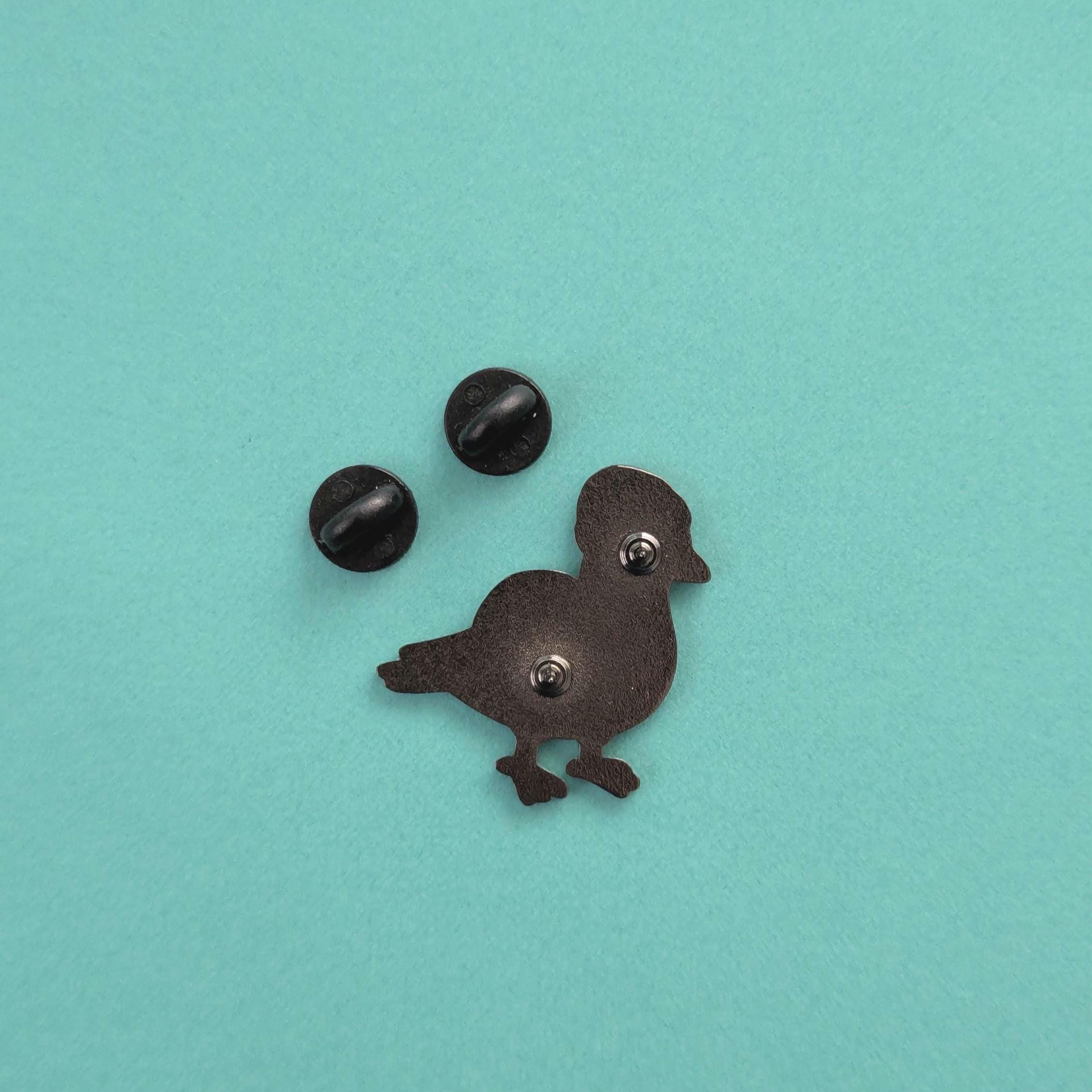 back view of pigeon pin badge