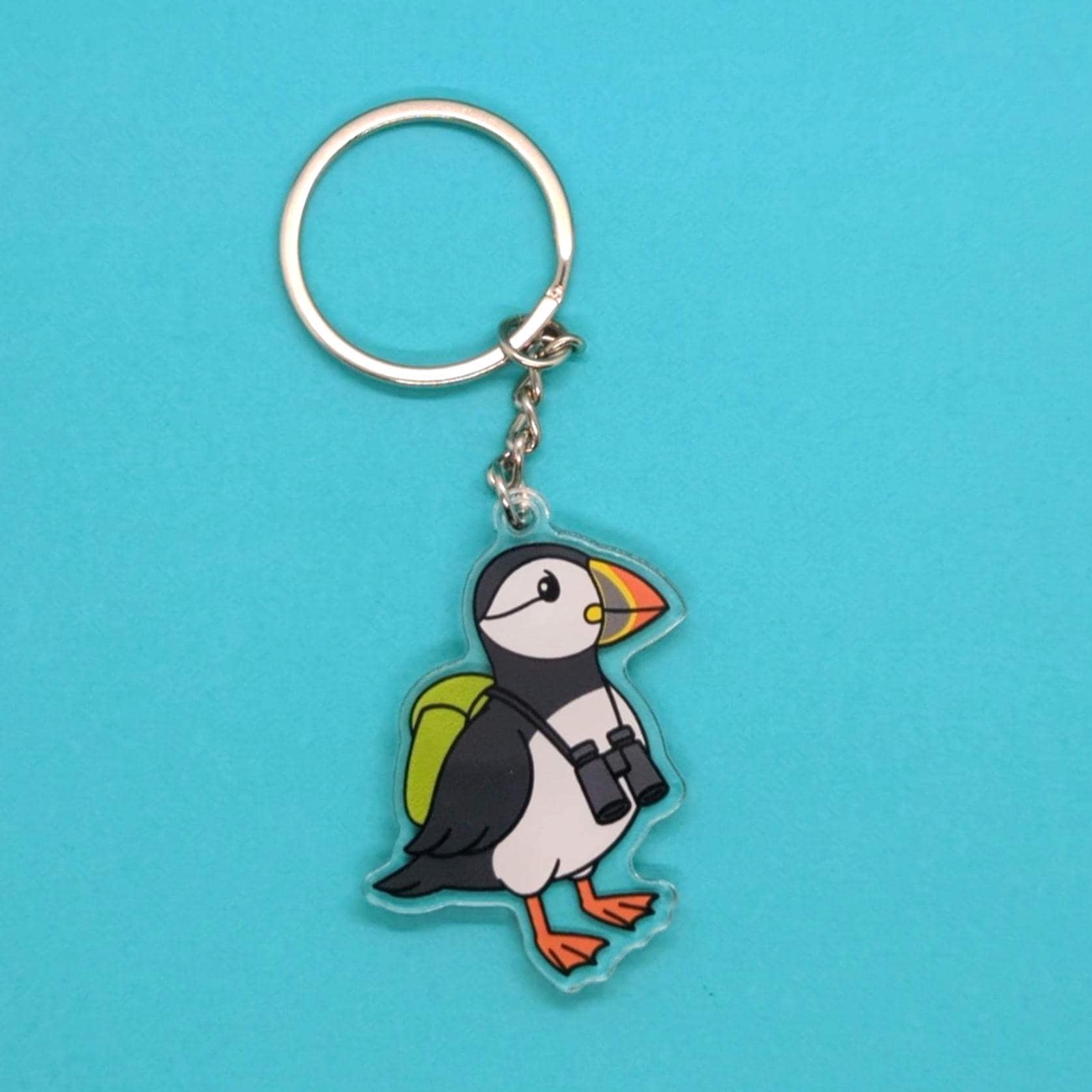 Keychain with a puffin design on a blue background