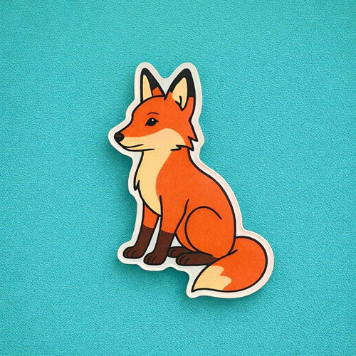Red fox fridge magnet on a blue background