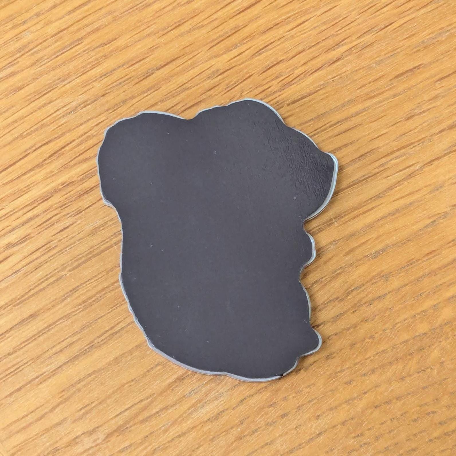 back of squirrel fridge magnet