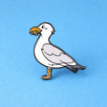 Seagull pin on a blue background