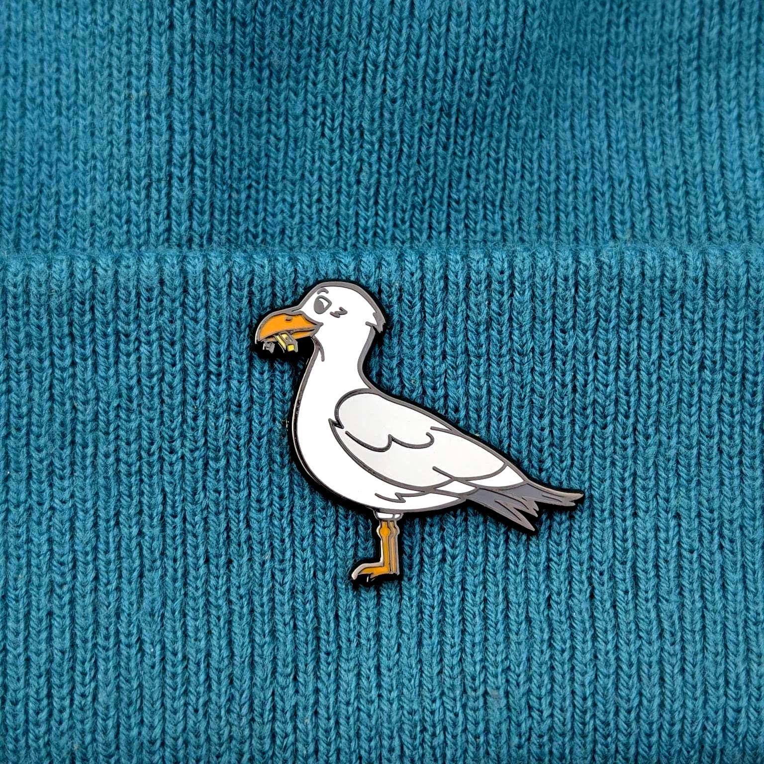 Seagull pin on a textured blue background