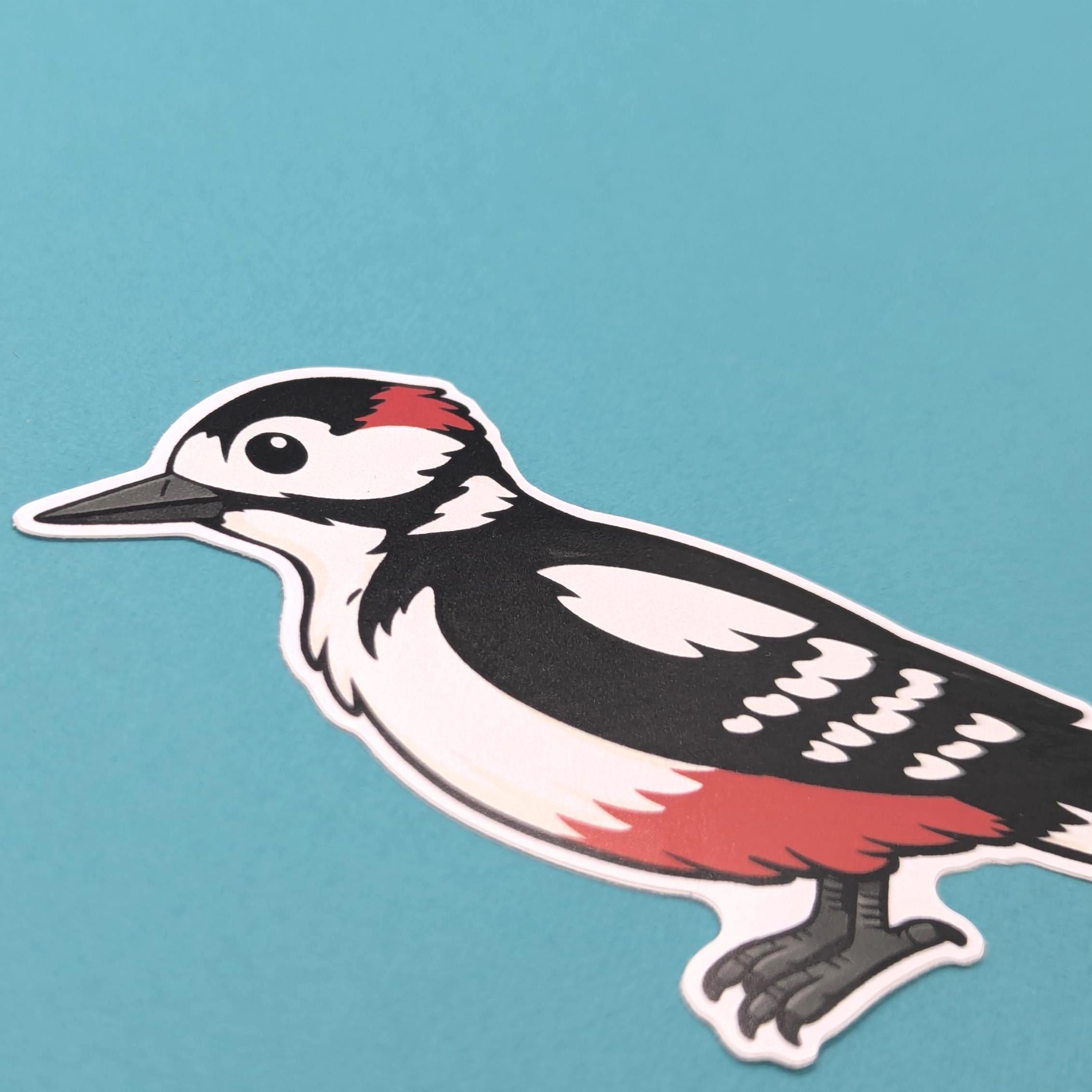 Sticker of a woodpecker on a blue background