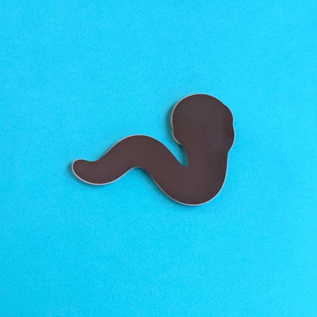 Back view of worm magnet on blue background